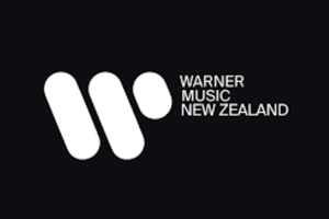 Warner Music logo white on black text (1)